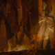 Sauron raises his hand to the sky in the heart of Mount Doom, celebrating the forging of the One Ring.